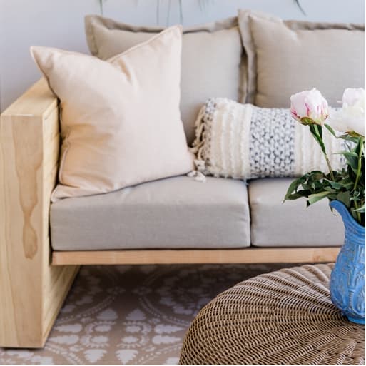 Indoor sofa with cushions on it